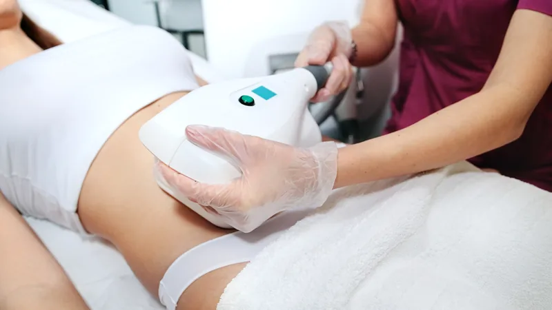 Fat freezing cryolipolysis treatment being applied to abdomen